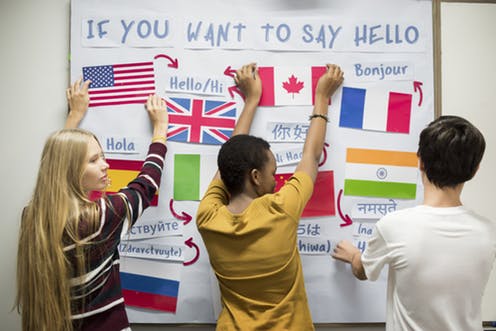 Students working on a world language bulletin board