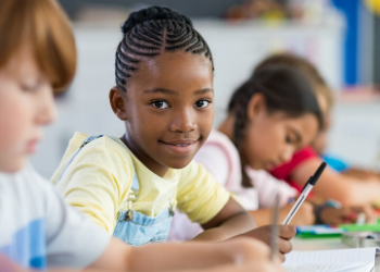 Students in a classroom working on homework